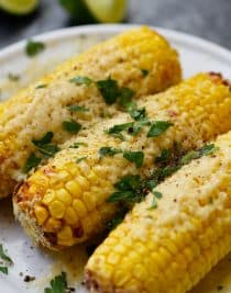 Air Fryer Mexican Street Corn Recipe - This flavorful, super easy Mexican Street Corn recipe is ready in 15 minutes in the air fryer and always a favorite! // addapinch.com