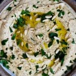 Classic Hummus Recipe - A traditional hummus recipe ready in minute! Perfect to serve as a snack, appetizer, or spread for sandwiches and wraps! // addapinch.com