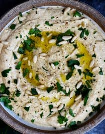 Classic Hummus Recipe - A traditional hummus recipe ready in minute! Perfect to serve as a snack, appetizer, or spread for sandwiches and wraps! // addapinch.com