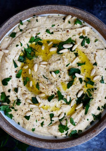 Classic Hummus Recipe - A traditional hummus recipe ready in minute! Perfect to serve as a snack, appetizer, or spread for sandwiches and wraps! // addapinch.com