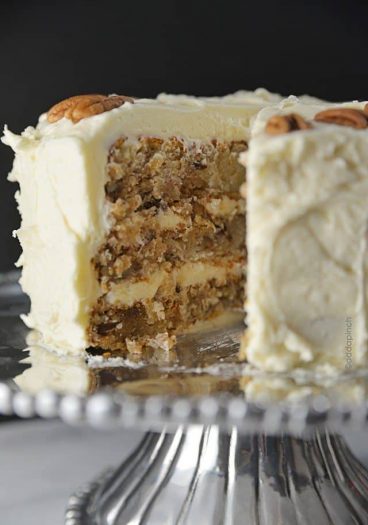 Hummingbird Cake Recipe - Hummingbird Cake is a classic, Southern cake recipe. Made with bananas, pineapple, and pecans and topped with a cream cheese frosting! from addapinch.com