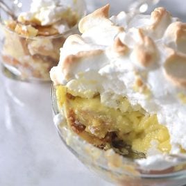 Southern Banana Pudding Recipe - An heirloom family recipe for banana pudding that is a classic, Southern dessert. Creamy, traditional banana pudding topped with airy meringue. // addapinch.com