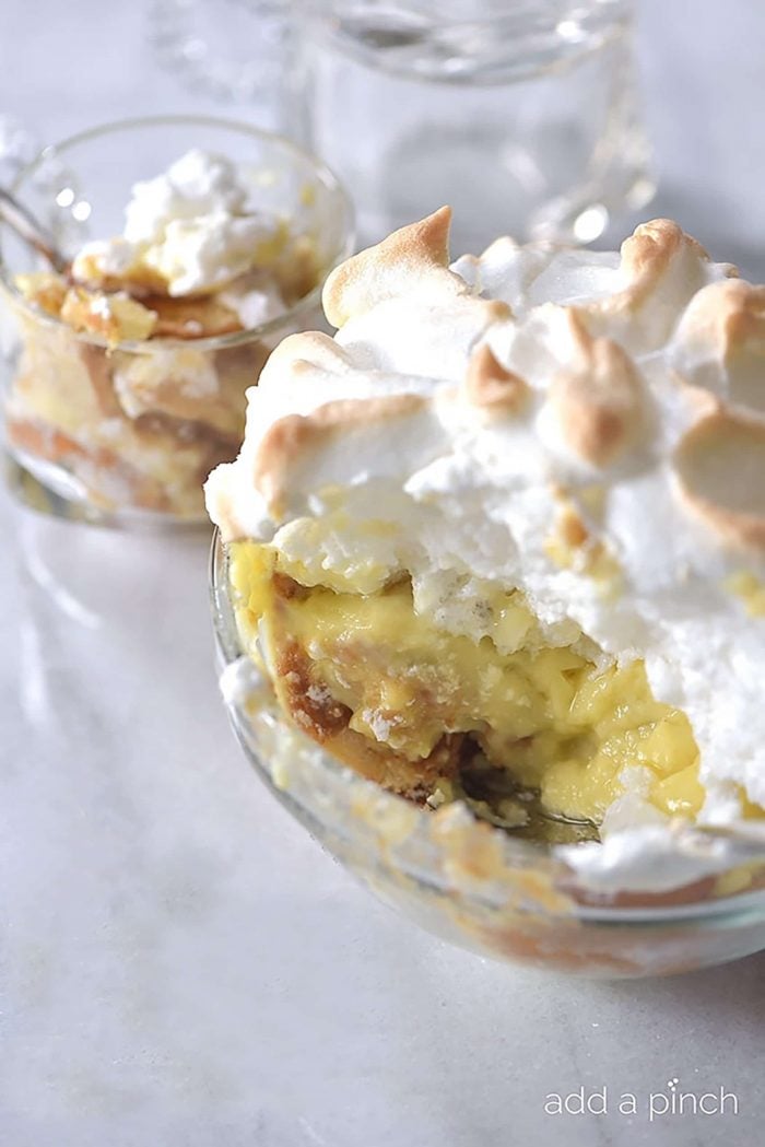 Banana Pudding with homemade Meringue in glass serving bowl // addapinch.com