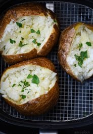 Air Fryer Baked Potato Recipe - This quick and easy air fryer baked potato recipe makes a perfect baked potato every time! Tender on the inside and crispy on the outside! // addapinch.com