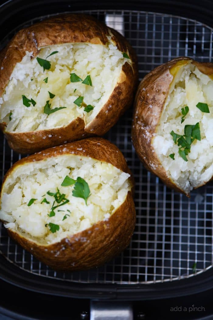 Air Fryer Baked Potato Recipe - This quick and easy air fryer baked potato recipe makes a perfect baked potato every time! Tender on the inside and crispy on the outside! // addapinch.com