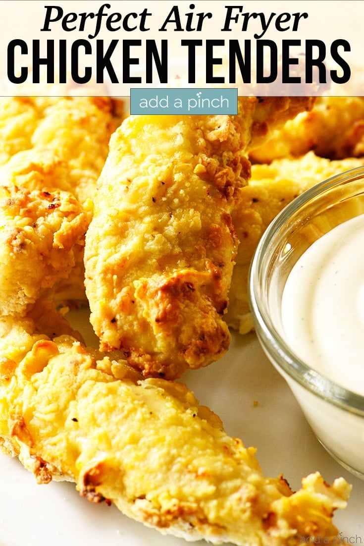 Golden brown Air Fryer Chicken Tenders on white plate with Ranch for dipping -with text - addapinch.com