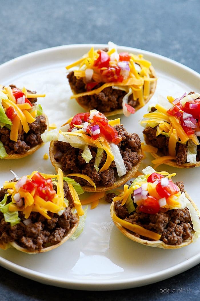 Taco Cups Recipe - This Taco Cups Recipe comes together in 15 minutes for a fast, fun, and fabulous dish! Made with just five ingredients, plus optional toppings, it is sure to be a weeknight staple! // addapinch.com