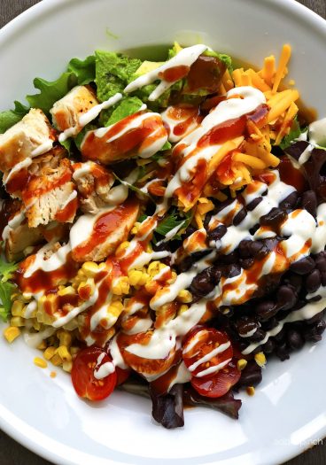 BBQ Ranch Chicken Cobb Salad Recipe - Filled with grilled chicken, corn, black beans, avocado, bacon and more, this flavorful chicken cobb salad recipe is perfect for lunch or supper!  // addapinch.com