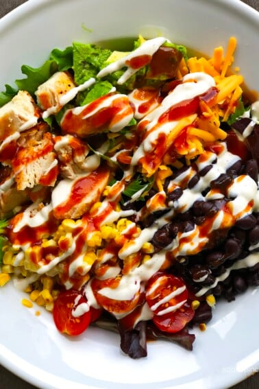 BBQ Ranch Chicken Cobb Salad Recipe - Filled with grilled chicken, corn, black beans, avocado, bacon and more, this flavorful chicken cobb salad recipe is perfect for lunch or supper!  // addapinch.com