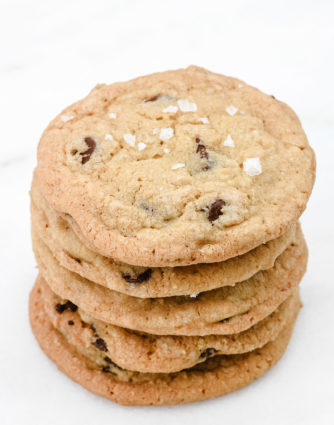 Chewy Chocolate Chip Cookie recipe with a secret little ingredient. They are soft, chewy, and amazing! Learn the secrets to the chocolate chip cookies that everyone requests! // addapinch.com