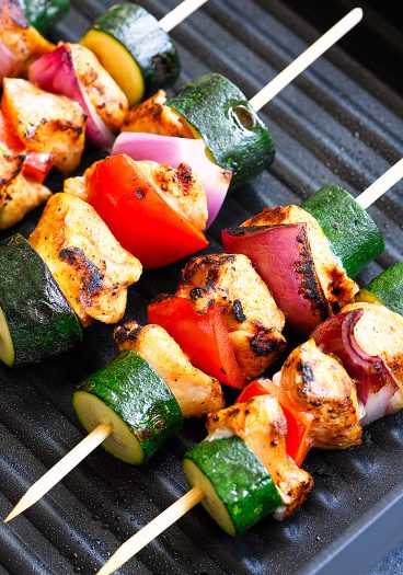Chili Rubbed Chicken Skewers Recipe - Ready in minutes, these chicken skewers are a weekend AND a weeknight favorite! The secret is the chili rubbed chicken! // addapinch.com