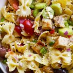 Greek Chicken Pasta Salad Recipe - This easy pasta salad recipe is so easy and delicious! Made with grilled chicken, pasta, an assortment of vegetables and topped with feta cheese and a delicious Greek dressing!  // addapinch.com