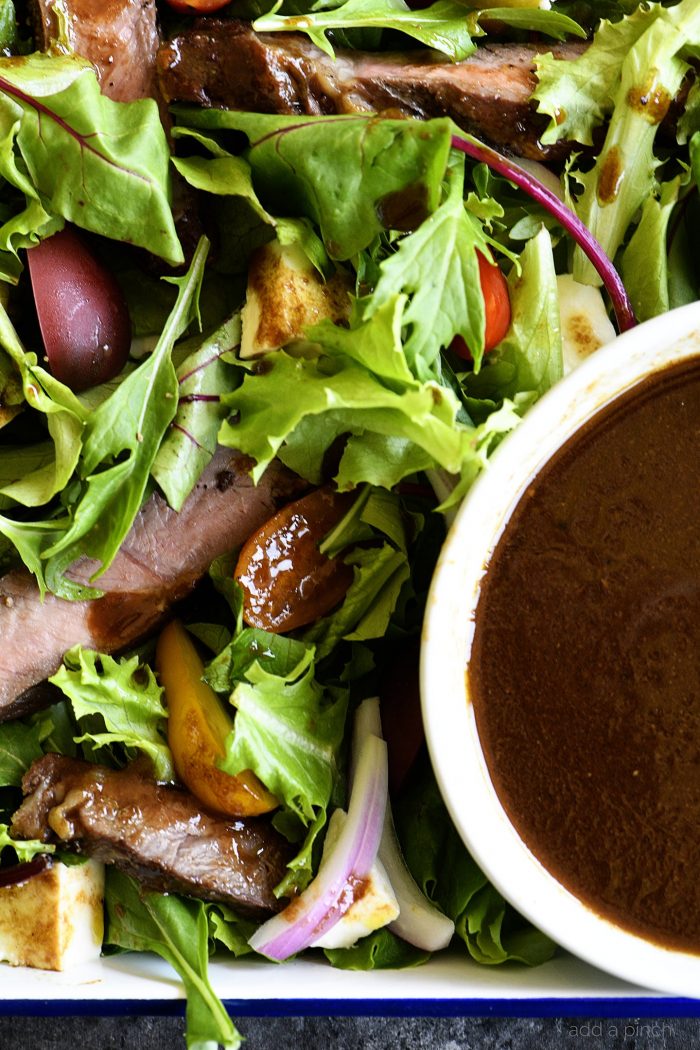 Closeup of salad and balsamic in a bowl // addapinch.com