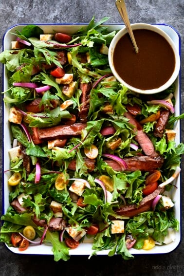Balsamic Steak Salad Recipe - A hearty balsamic steak salad recipe is served with lots fresh vegetables, mozzarella, fresh basil and a Homemade Balsamic Vinaigrette. 