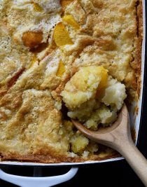 Easy Peach Cobbler Recipe - This easy peach cobbler makes the perfect Southern dessert! A buttery crust bakes along with the sweet peaches for the best peach cobbler in three easy steps! // addapinch.com