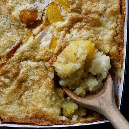 Easy Peach Cobbler Recipe - This easy peach cobbler makes the perfect Southern dessert! A buttery crust bakes along with the sweet peaches for the best peach cobbler in three easy steps! // addapinch.com