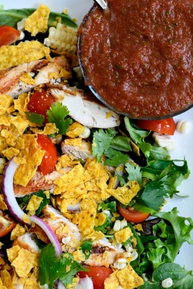 Grilled Chicken Fiesta Salad Recipe - This simple grilled chicken salad recipe is kicked up a notch for a spicy Tex-Mex favorite! // addapinch.com