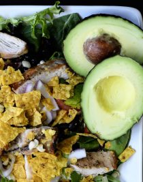 Grilled Chicken Fiesta Salad Recipe - This simple grilled chicken salad recipe is kicked up a notch for a spicy Tex-Mex favorite! // addapinch.com