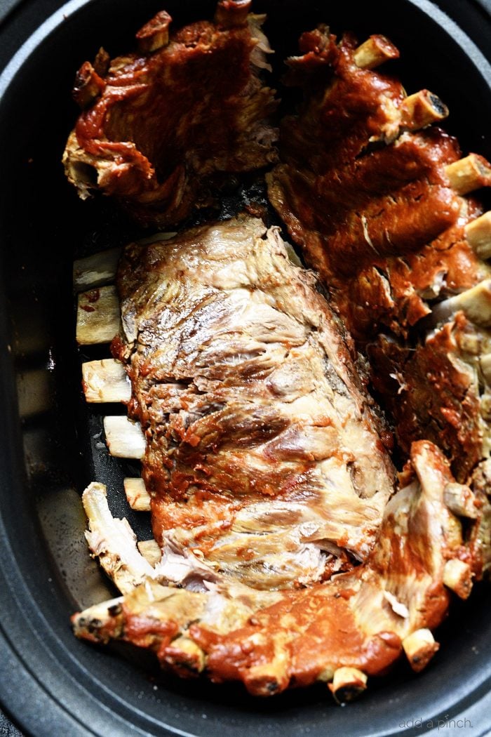 Cooked rack of ribs in slow cooker // addapinch.com