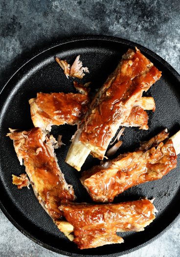 Easy Slow Cooker Ribs Recipe - This easy slow cooker ribs recipe makes tender, fall off the bone ribs! No grill or oven is required with these amazing ribs! // addapinch.com