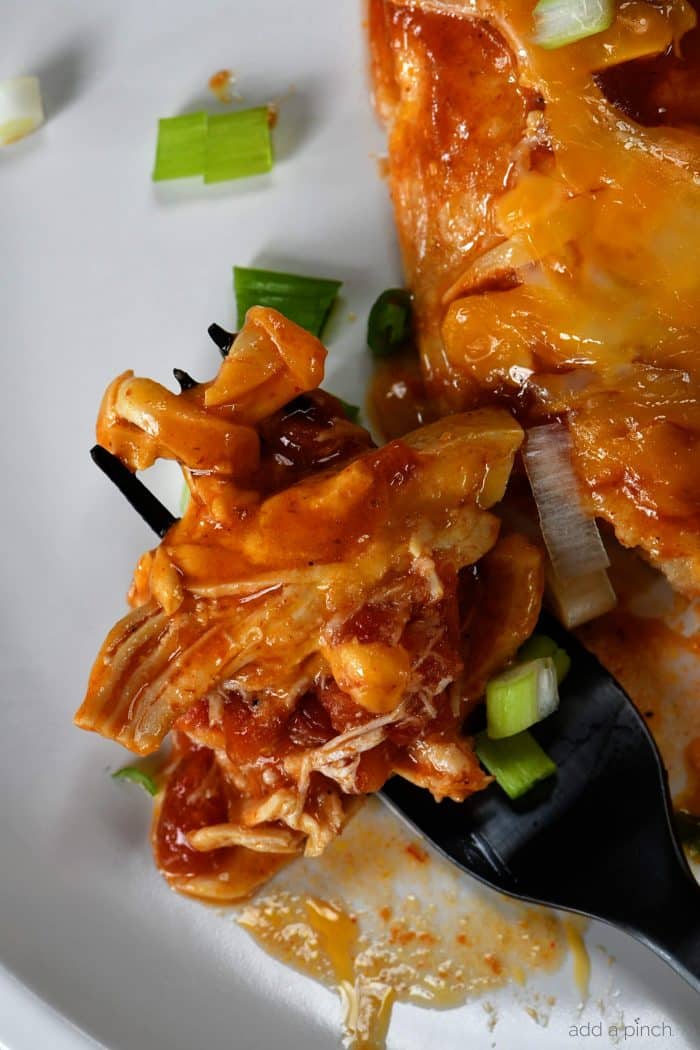 Buffalo Chicken Enchiladas Recipe - These quick and easy buffalo chicken enchiladas are so simple, yet scrumptious! Ready and on the table in 30 minutes! // addapinch.com