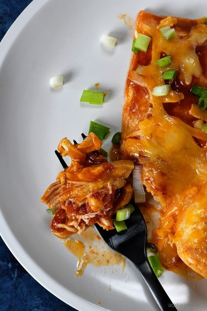 Buffalo Chicken Enchiladas Recipe - These quick and easy buffalo chicken enchiladas are so simple, yet scrumptious! Ready and on the table in 30 minutes! // addapinch.com