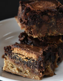 Peanut Butter Cup Brookies Recipe - This recipe takes brownies to a whole new level! Layers of chocolate chip cookie, fudgy brownies, and peanut butter cups make a dessert that everyone loves! // addapinch.com