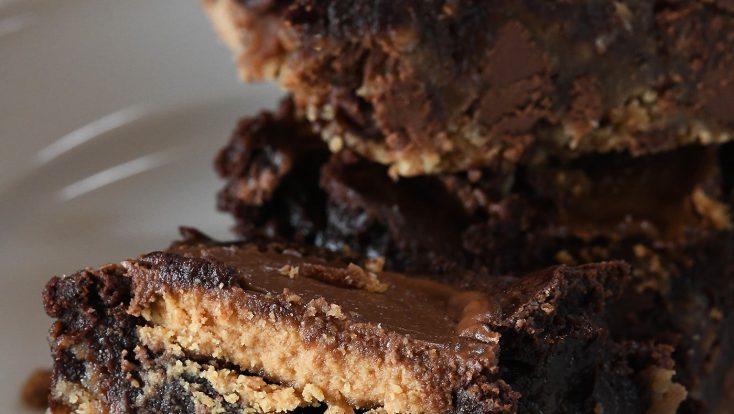 Peanut Butter Cup Brookies Recipe - This recipe takes brownies to a whole new level! Layers of chocolate chip cookie, fudgy brownies, and peanut butter cups make a dessert that everyone loves! // addapinch.com
