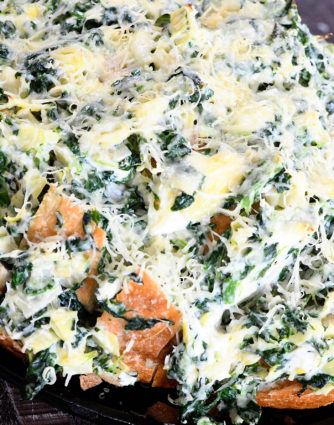 Spinach Artichoke Pull Apart Bread Recipe - Everyone's favorite spinach artichoke served in a whole new way in this fun and easy pull apart bread! // addapinch.com