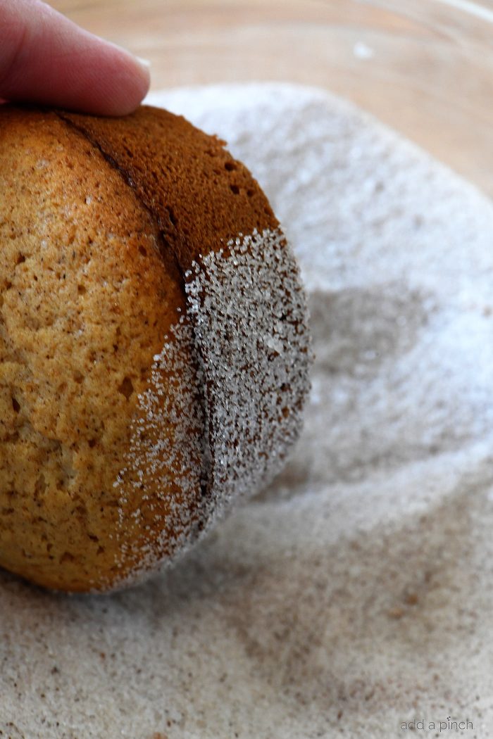 Apple Cider Donut Muffins Recipe - These apple cider muffins are light, fluffy and coated in an amazing cinnamon sugar coating! // addapinch.com