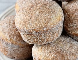 Apple Cider Donut Muffins Recipe - These apple cider muffins are light, fluffy and coated in an amazing cinnamon sugar coating! // addapinch.com