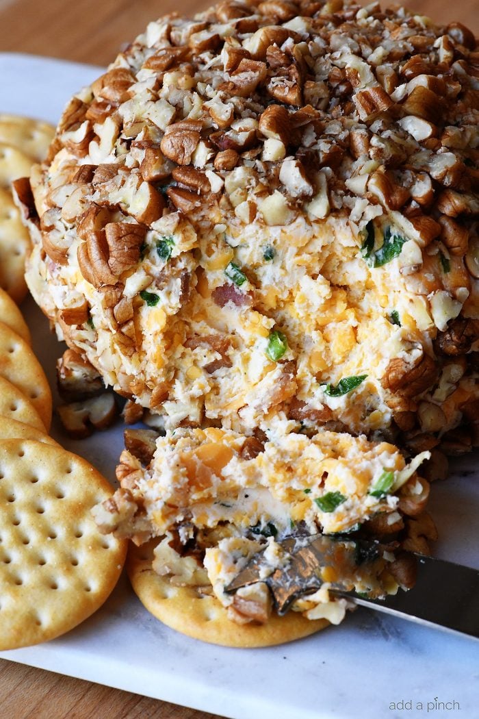 Bacon Ranch Cheese Ball Recipe - This creamy, dreamy cheese ball melds together bacon, ranch seasoning, and is the encased in chopped pecans. Perfect for easy entertaining! // addapinch.com