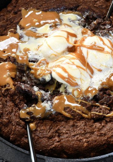 Double Chocolate Caramel Skillet Cookie Recipe - This scrumptious chocolate cookie recipe brings together the richness of chocolate and creamy caramel all in one delicious skillet recipe! // addapinch.com