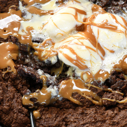 Double Chocolate Caramel Skillet Cookie Recipe - This scrumptious chocolate cookie recipe brings together the richness of chocolate and creamy caramel all in one delicious skillet recipe! // addapinch.com