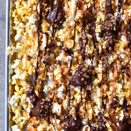Caramel Crunch Popcorn Recipe - This quick and easy crunch popcorn recipe is perfect for the sweet and salty lover! Ready in minutes! // addapinch.com