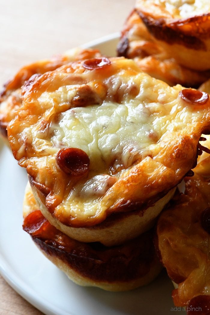 Close up view of Deep Dish Pizza Cups filled with cheese and pepporini.