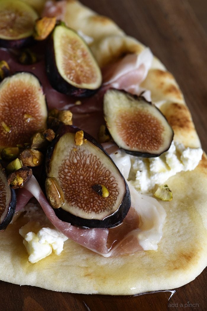 Honeyed Prosciutto Fig Flatbread Recipe - This quick flatbread recipe makes an elegant appetizer recipe that is just as scrumptious as it is beautiful! // addapinch.com