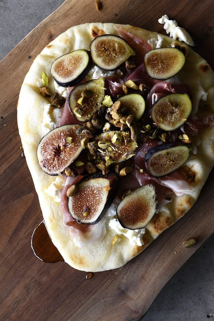 Honeyed Prosciutto Fig Flatbread Recipe - This quick flatbread recipe makes an elegant appetizer recipe that is just as scrumptious as it is beautiful! // addapinch.com