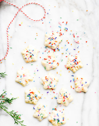 Classic Buttery Spritz Cookies make an easy delicious buttery cookie that comes together quickly! Perfect for special occasions and holidays, these spritz cookies are a favorite! // addapinch.com