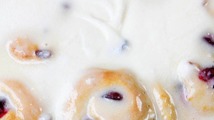 Cranberry Orange Rolls Recipe - The perfect blend of sweet and tart comes together in these easy Cranberry Orange Rolls! Topped with Orange Cream Frosting! // addapinch.com