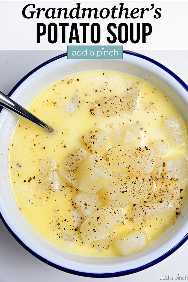 Potato Soup seasoned with black pepper in bowl with spoon - addapinch.com