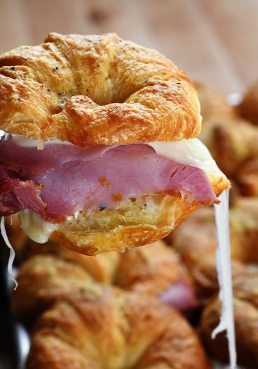 Ham and Cheese Croissants Recipe - These tasty, buttery, cheesy croissants are so simple to make and even more delicious to eat! Perfect for parties, entertaining, football games, and the holidays! // addapinch.com