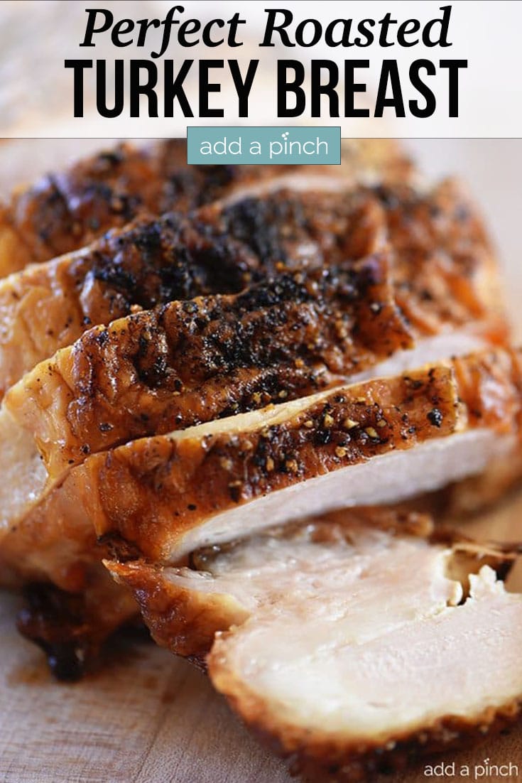 Roasted Turkey Breast with golden crust on top and juicy white meat showing in the slices - with text - addapinch.com