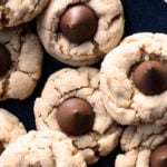 Peanut Butter Blossoms Recipe - This soft classic peanut butter cookie topped with a milk chocolate kiss is always a favorite! // addapinch.com