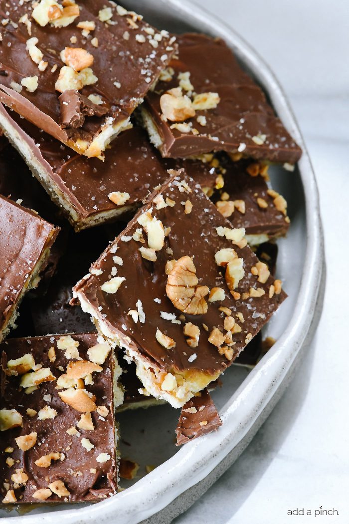 Saltine Cracker Toffee Candy Recipe - Cracker toffee or Christmas crack is a favorite, easy recipe made with only five ingredients! // addapinch.com