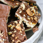 Tray of nut covered saltine cracker toffee.