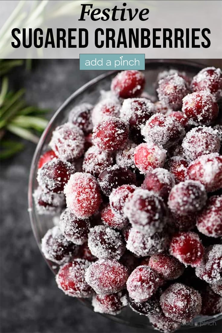 Bowl of Sugared Cranberries surrounded by rosemary - with text - addapinch.com