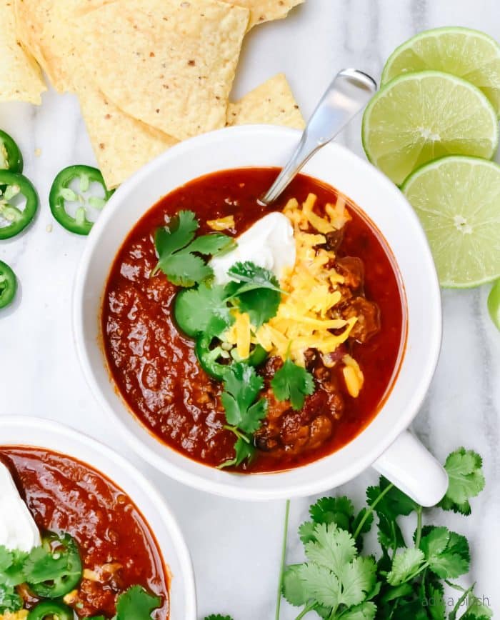 The Best Instant Pot Chili Recipe - This easy Instant Pot Chili is ready in 30 minutes, yet tastes like it has been simmering for hours!  // addapinch.com