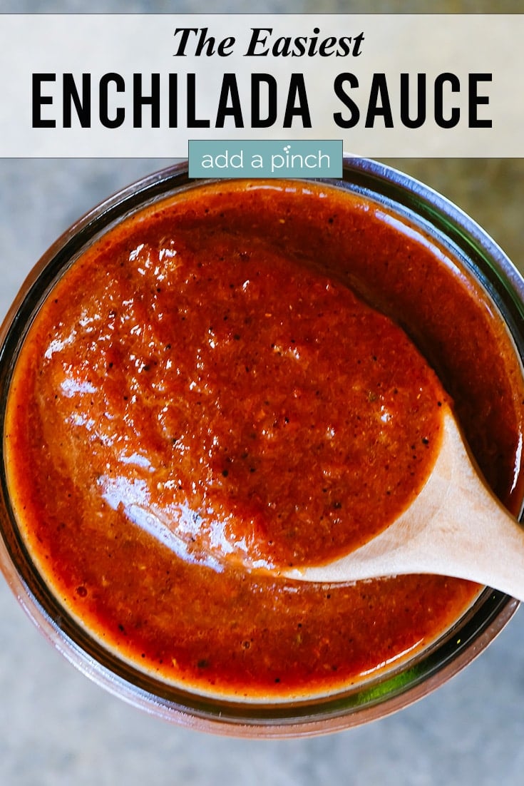 Enchilada Sauce with Spoon - with text - addapinch.com