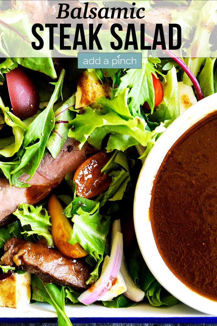 Balsamic Steak Salad with white bowl filled with Balsamic Dressing - with text - addapinch.com